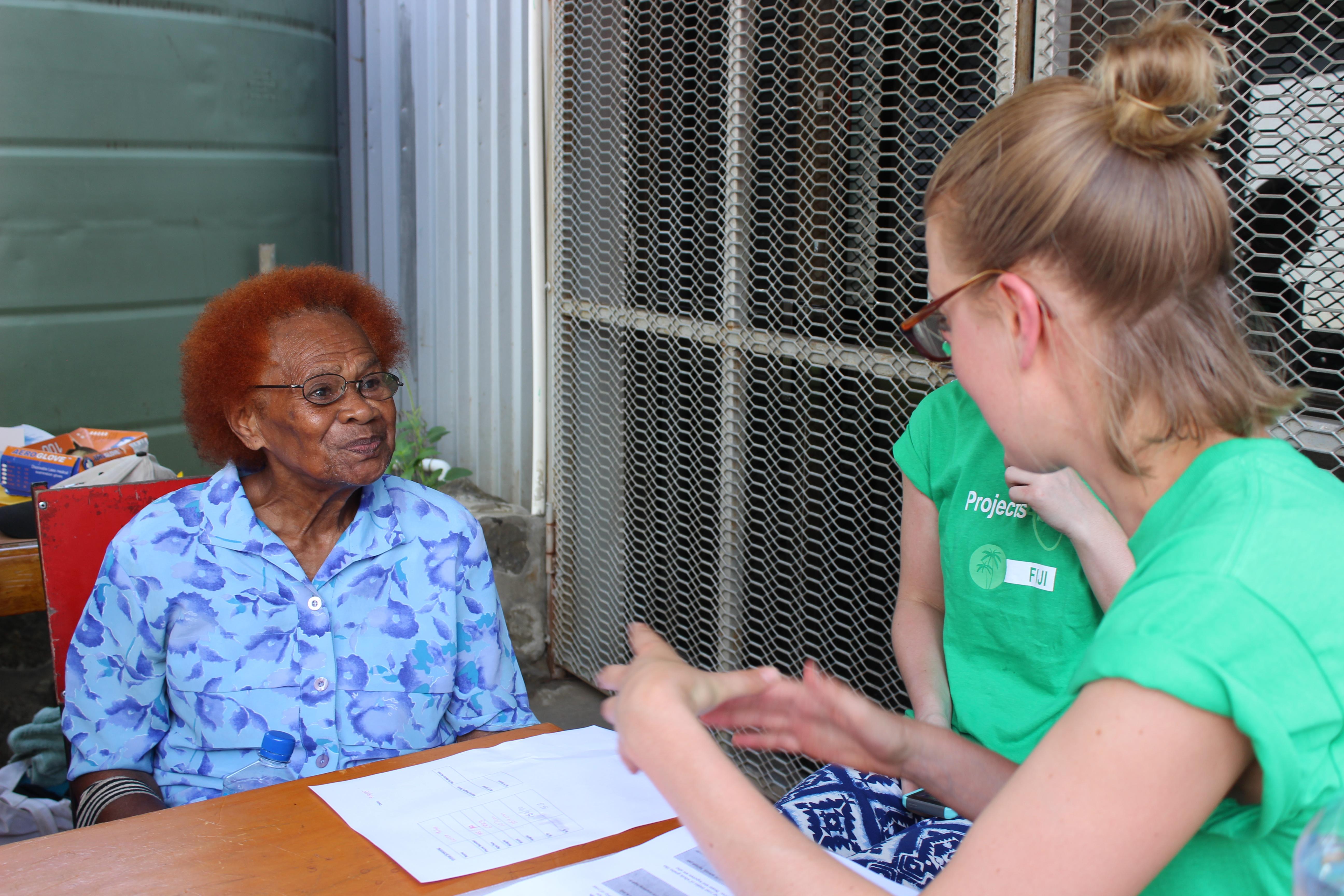 A female Projects Abroad intern is talking to a local elderly lady about her medical experience whilst completing her nutritional internship in Fiji. A young intern is pictured with an elderly local lady discussing her medical experience whilst she is on her nutritional internship in Fiji with Projects Abroad.
